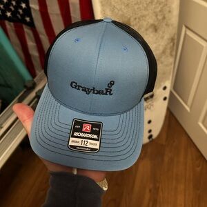 Brand new Graybar Blue and Black Trucker Hat